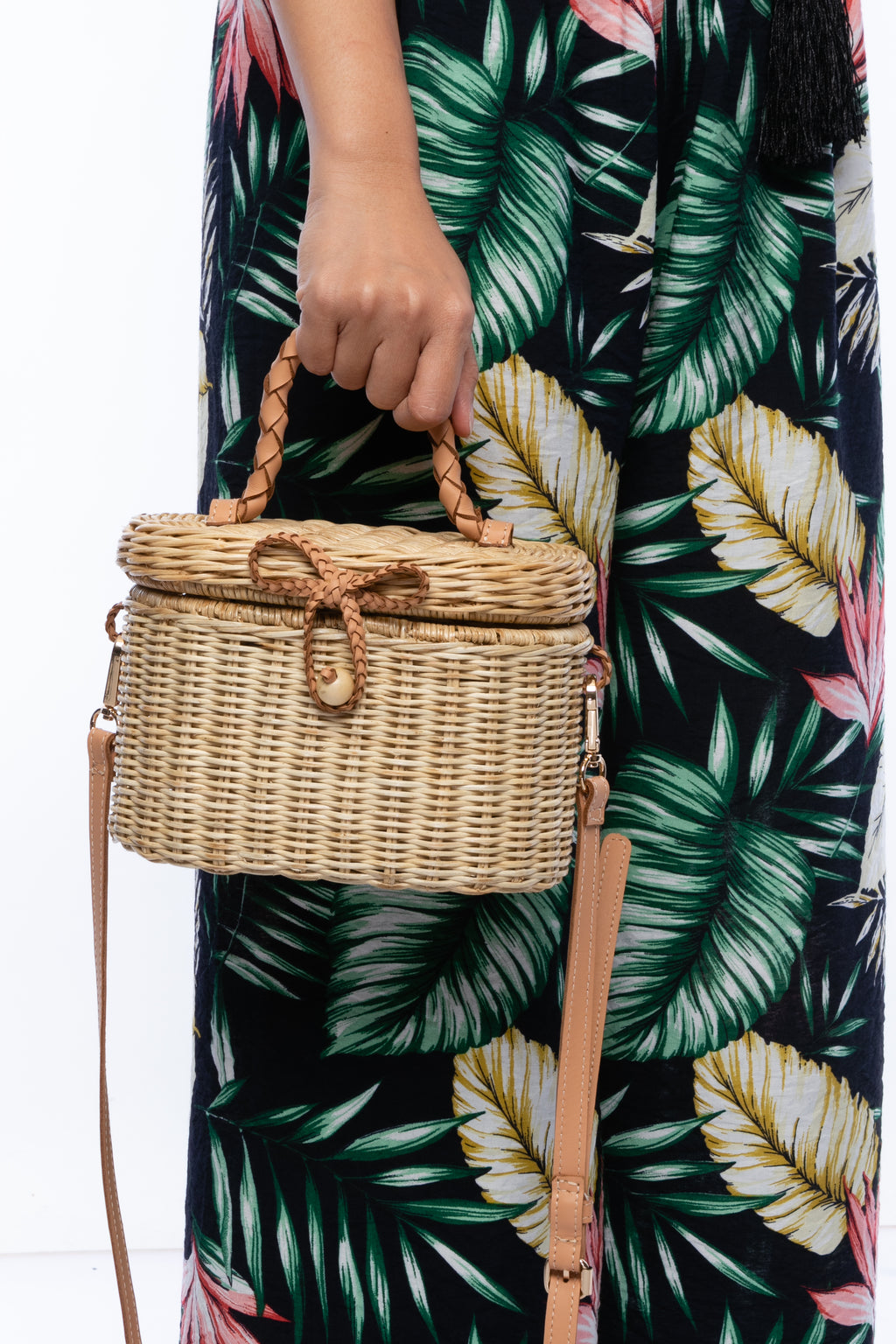 Camille Rattan Shoulder Bag made from handwoven rattan with adjustable leather strap and brass hardware. Eco-friendly and stylish design for any occasion.
