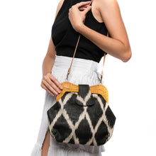 Load image into Gallery viewer, Diamond Dusk Libby handwoven purse with a rattan frame, diamond pattern, and leather strap. A versatile and eco-friendly accessory.
