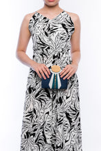 Load image into Gallery viewer, Gatsby Navy half-moon clutch made from handwoven natural plant fibers with a cracked sea shell bar and a brass chain strap, offering elegance and sophistication for evening events.
