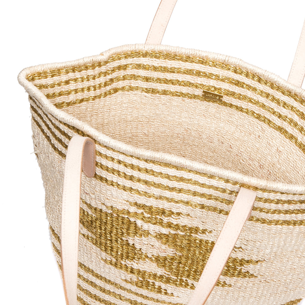 Golden Eagle Tote – Versatile handwoven natural plant fiber tote with Vachetta leather handles, ideal for beach days, shopping trips, and city outings.
