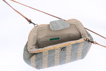 Load image into Gallery viewer, Grey Skye Signature Clutch – Handwoven raffia and rattan clutch with hand embroidery, featuring a removable leather strap for versatile styling.

