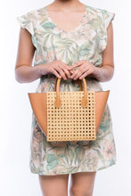 Load image into Gallery viewer, Honeycomb Solihiya rattan bag, handwoven with natural rattan and featuring leather handles, a linen lining, and a timeless design perfect for everyday use.
