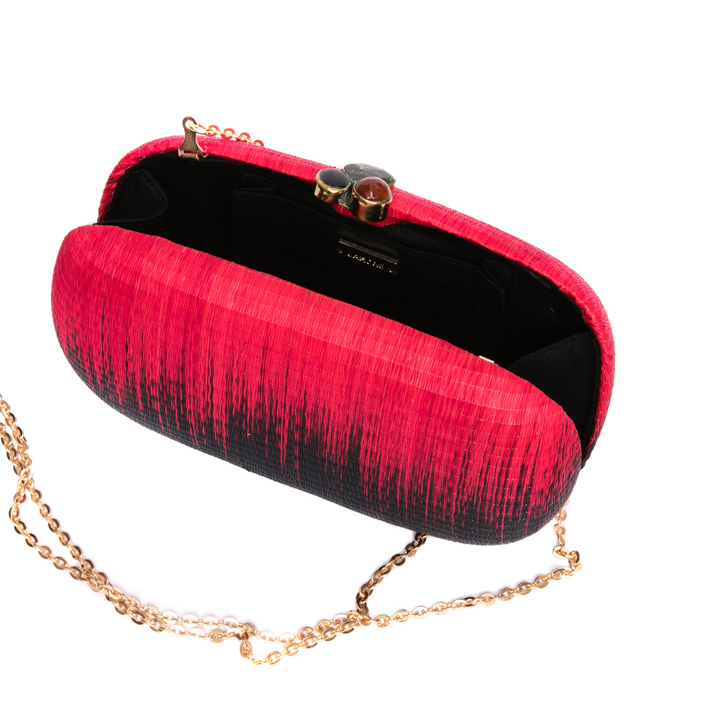 Horizon oval hard case purse handwoven from natural plant fibers, featuring agate stone accents wrapped in brass, a twill lining, and a brass drop-in chain for versatile wear.