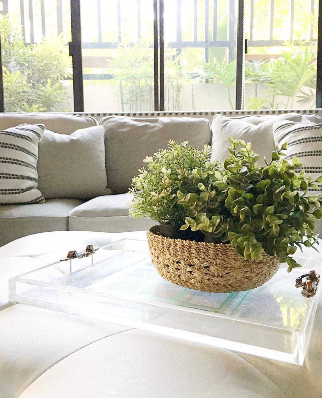 Handwoven natural plant fiber Myra Catch All tray for organizing jewelry, keys, and other essentials.