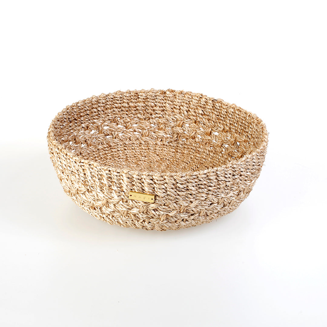 Handwoven natural plant fiber Myra Catch All tray for organizing jewelry, keys, and other essentials.