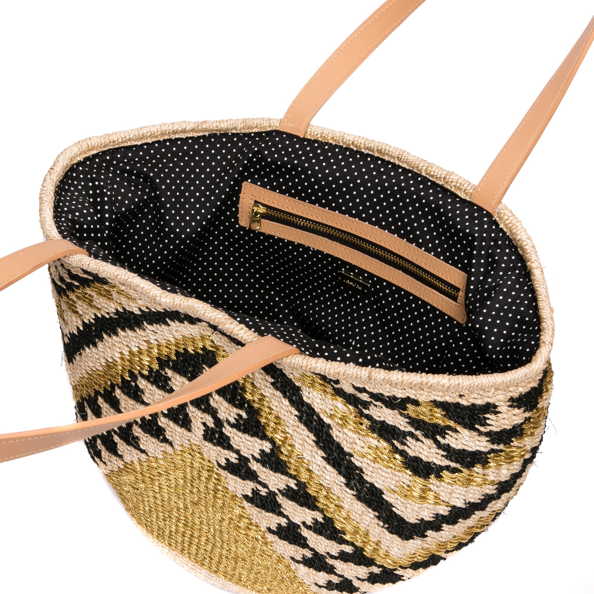 Queen of the Hills Millie Tote, handwoven from natural plant fibers and polyester cord, featuring cow leather handles, a polka dot cotton lining, and functional zippered and open pockets.