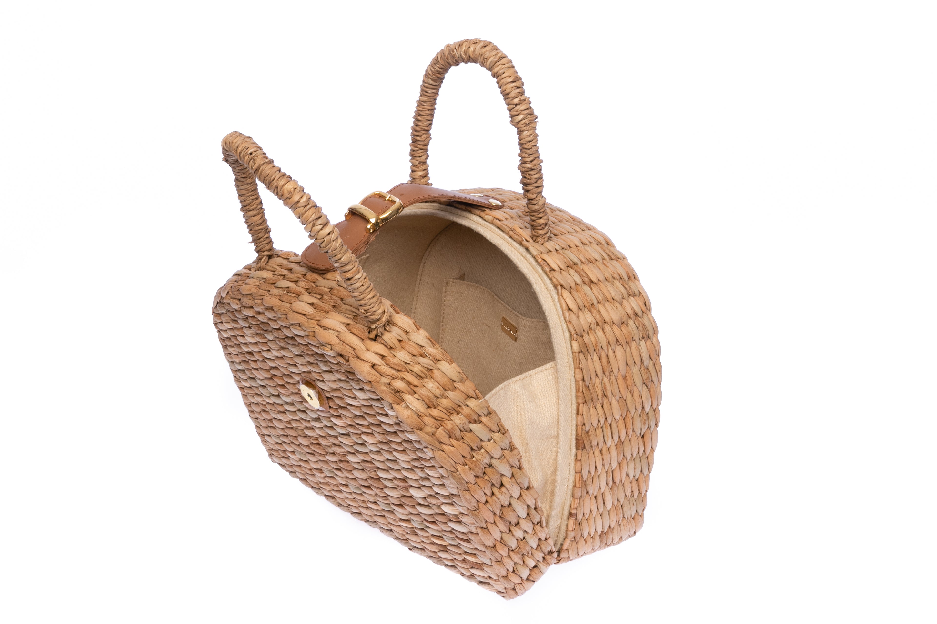 Rica Seagrass Lunchbox, handwoven from 100% seagrass with a removable leather shoulder strap, lined with linen-cotton blend fabric, perfect for lunch or daily essentials.