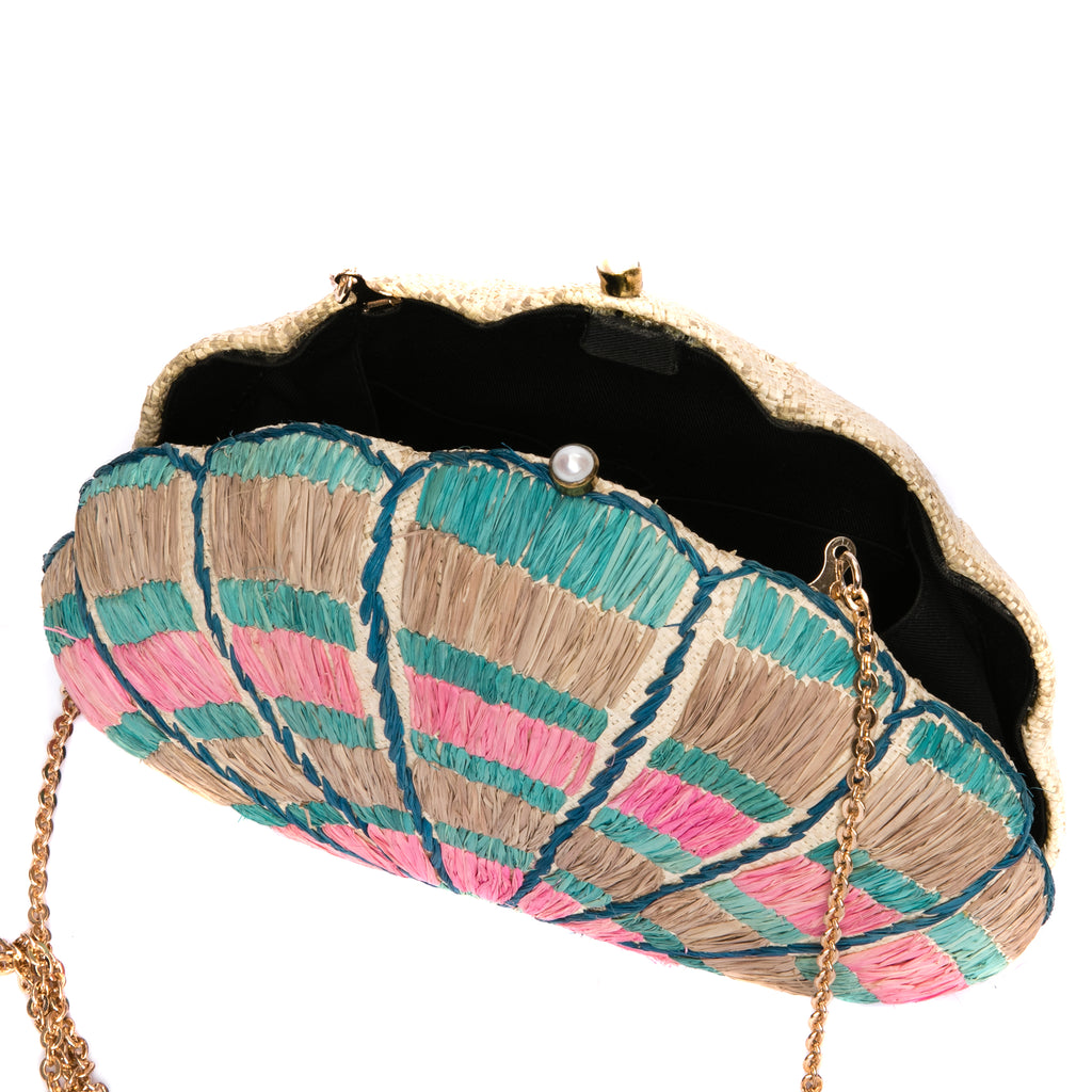 Seashell Karuna Rainbow Clutch, hand-loomed raffia body with hand embroidery, adorned with freshwater pearls wrapped in brass, and a versatile brass drop-in chain strap.