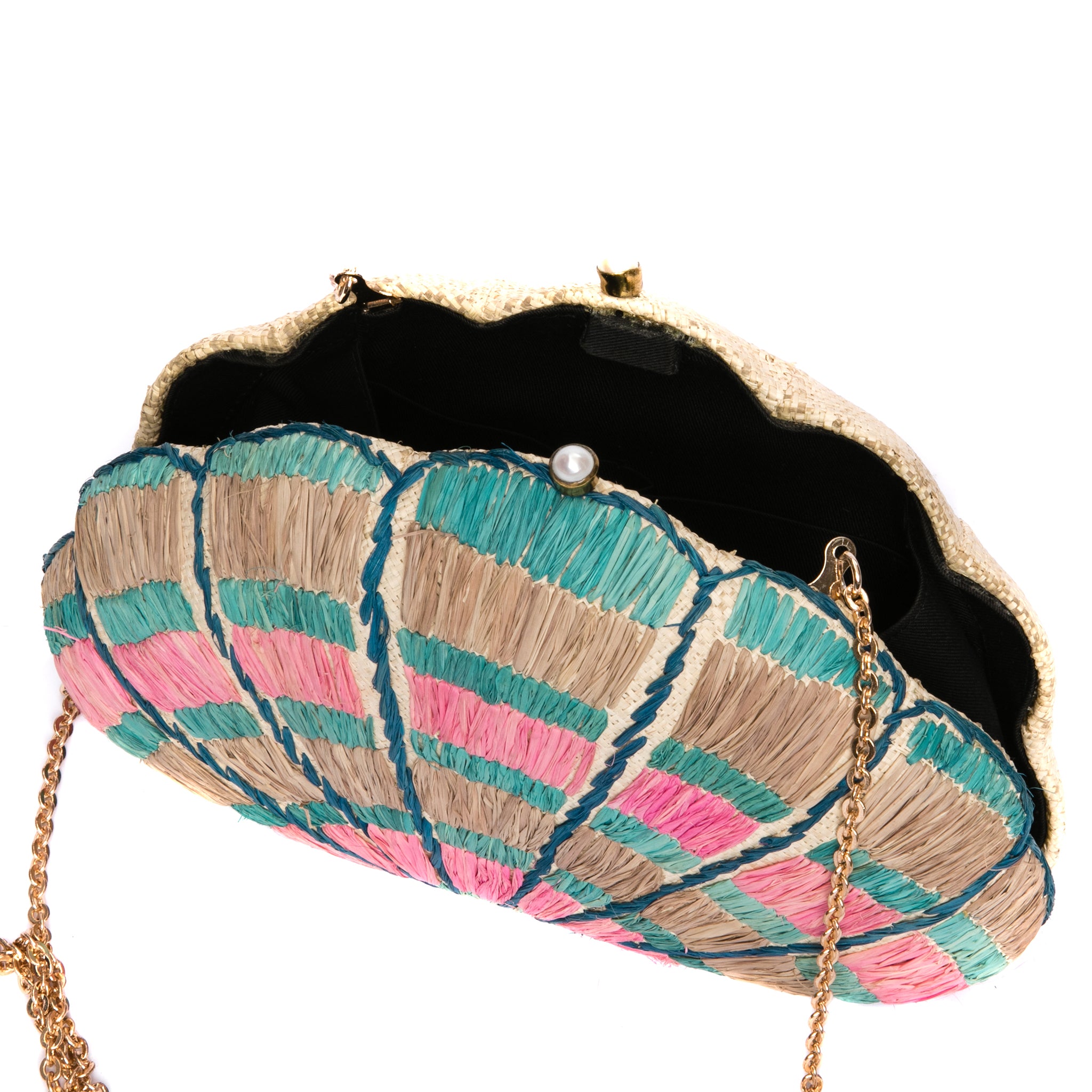 Seashell Karuna Rainbow Clutch, hand-loomed raffia body with hand embroidery, adorned with freshwater pearls wrapped in brass, and a versatile brass drop-in chain strap.