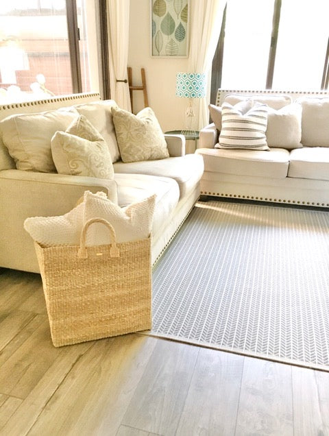 Serene Rectangle Storage basket, handcrafted from natural plant fibers, dimensions 17" Length x 10" Width x 19" Height. Ideal for storing laundry, sports equipment, and seasonal items.