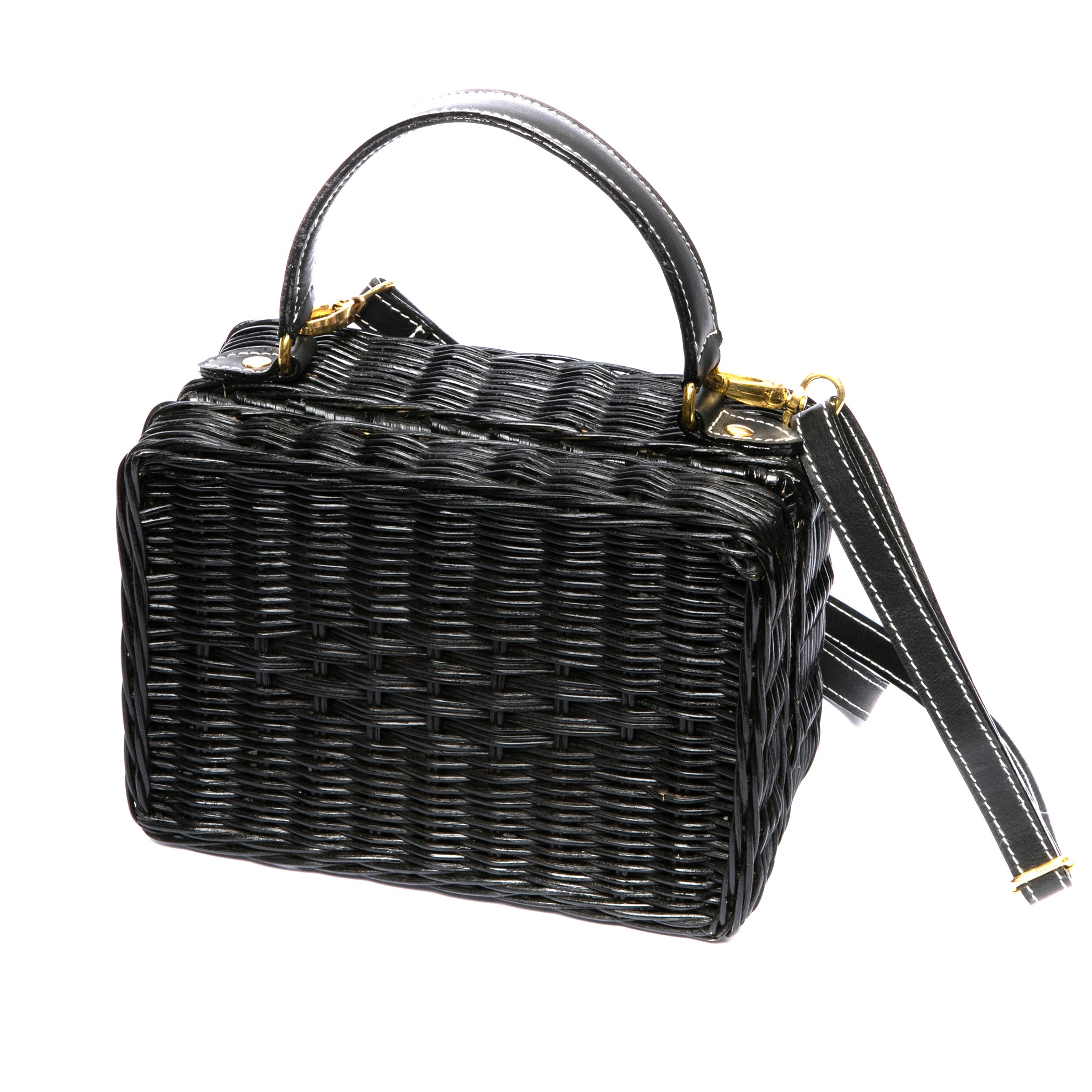 Serene Waters Wicker Bag made from handwoven rattan with an adjustable leather strap and cotton lining. Perfect for holding essentials with a chic and sustainable design.