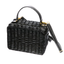 Load image into Gallery viewer, Serene Waters Wicker Bag made from handwoven rattan with an adjustable leather strap and cotton lining. Perfect for holding essentials with a chic and sustainable design.
