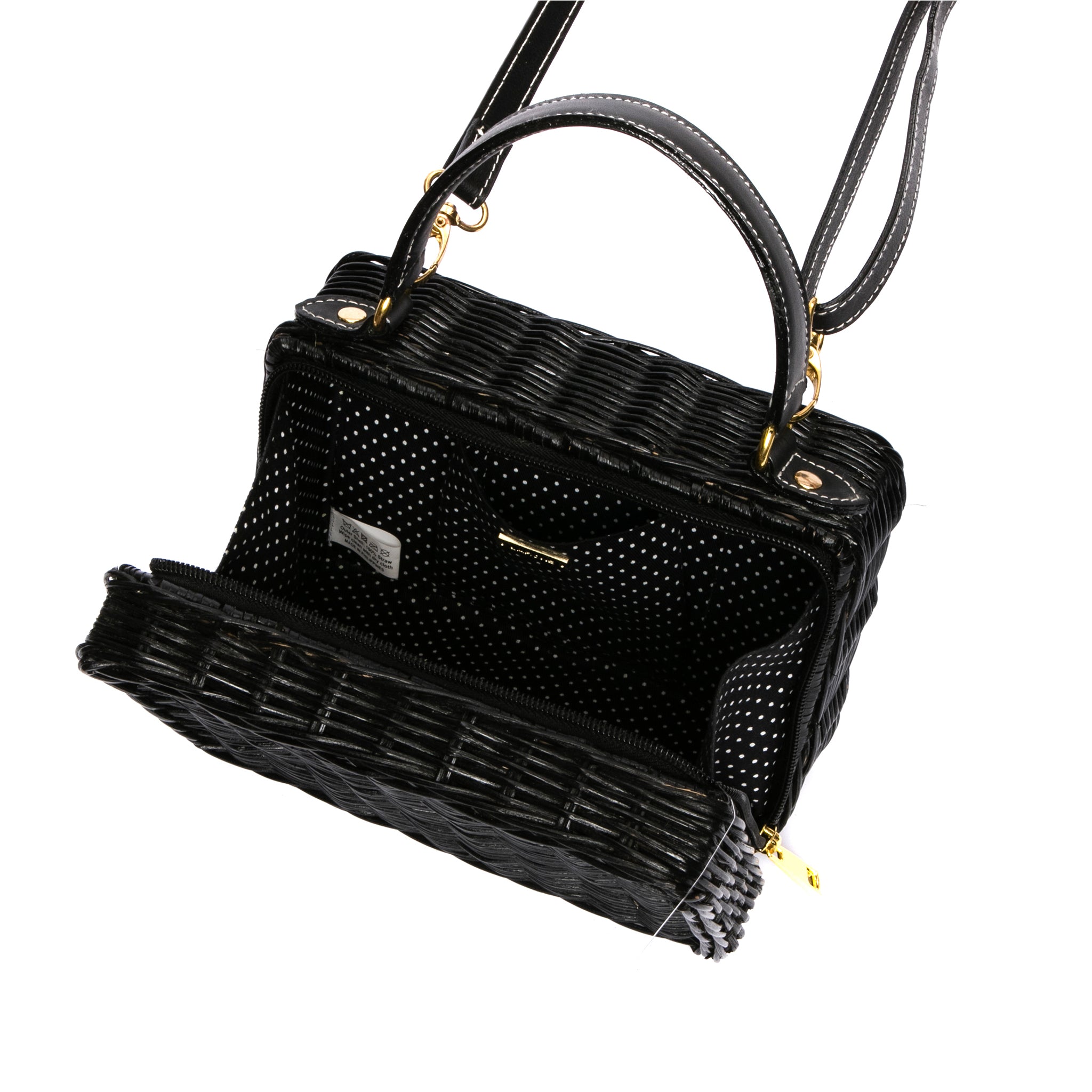 Serene Waters Wicker Bag made from handwoven rattan with an adjustable leather strap and cotton lining. Perfect for holding essentials with a chic and sustainable design.