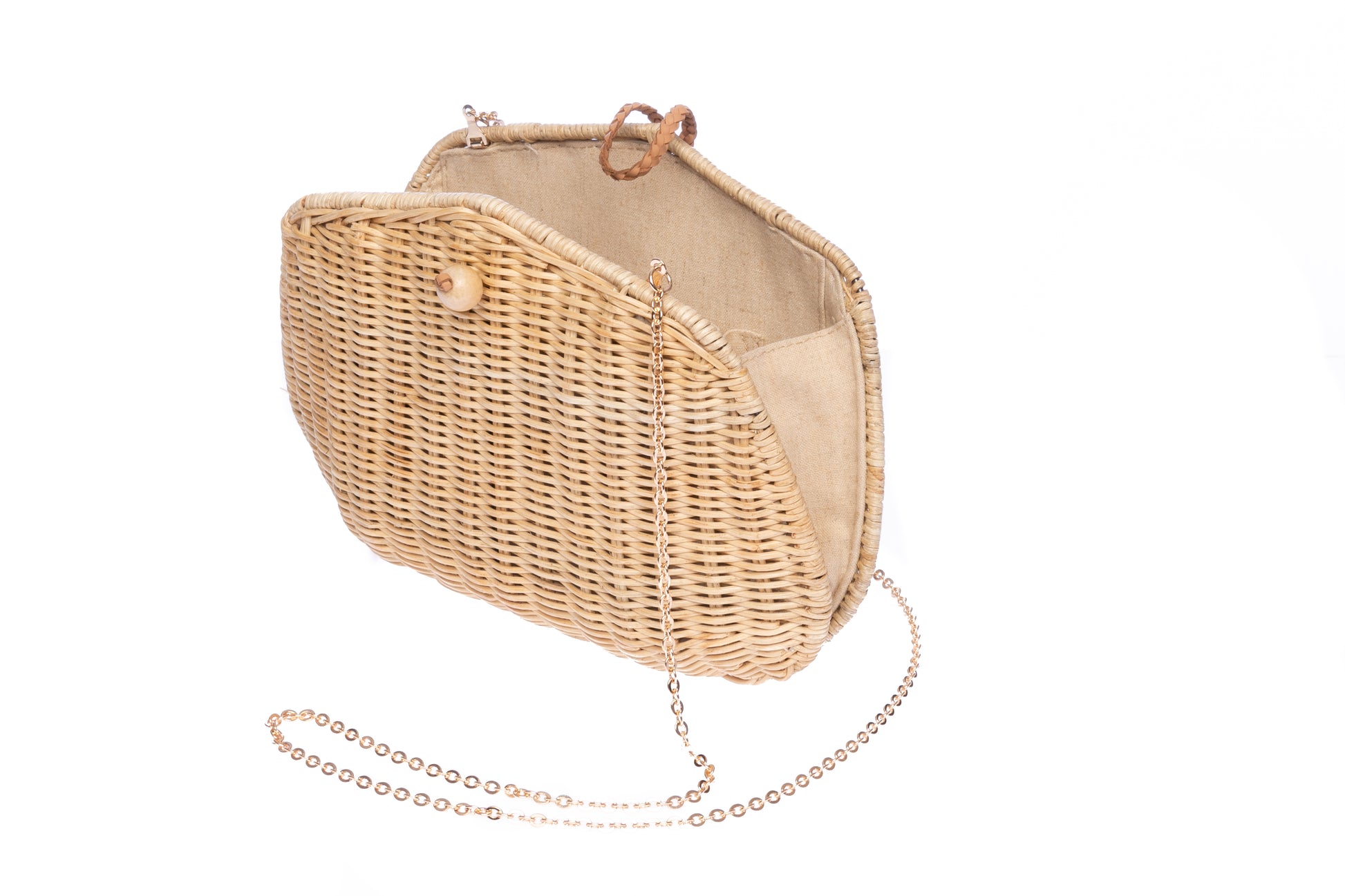 Stephanie Wicker Clutch made from handwoven rattan with a removable brass chain strap, perfect for day or night wear.