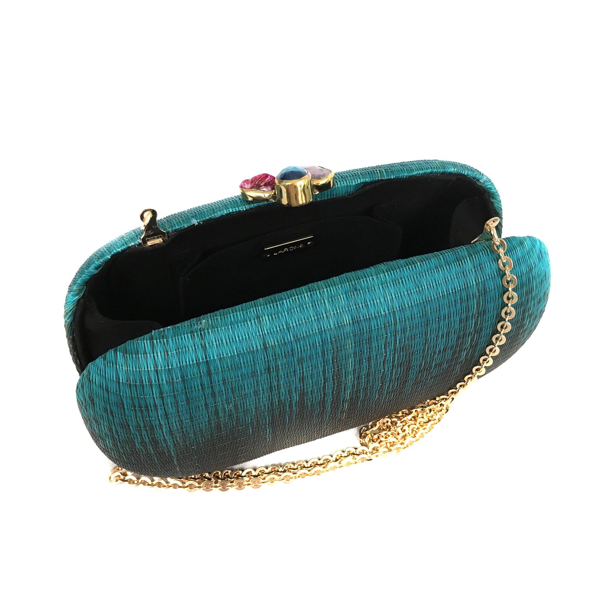 Turquoise Dream Oval Hard Case Purse made from handwoven Buri fiber, adorned with agate stones and brass accents, with a versatile drop-in brass chain for carrying as a clutch or shoulder bag.