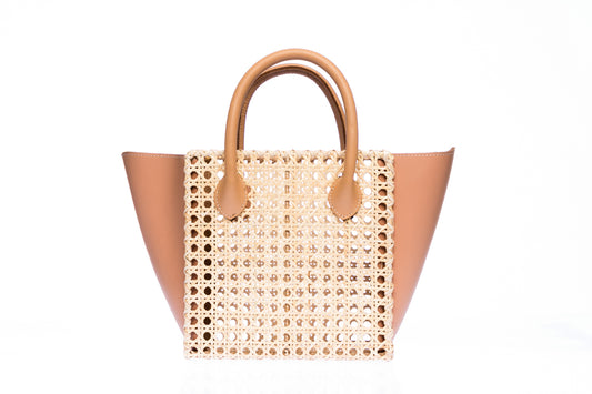 Honeycomb Solihiya rattan bag, handwoven with natural rattan and featuring leather handles, a linen lining, and a timeless design perfect for everyday use.