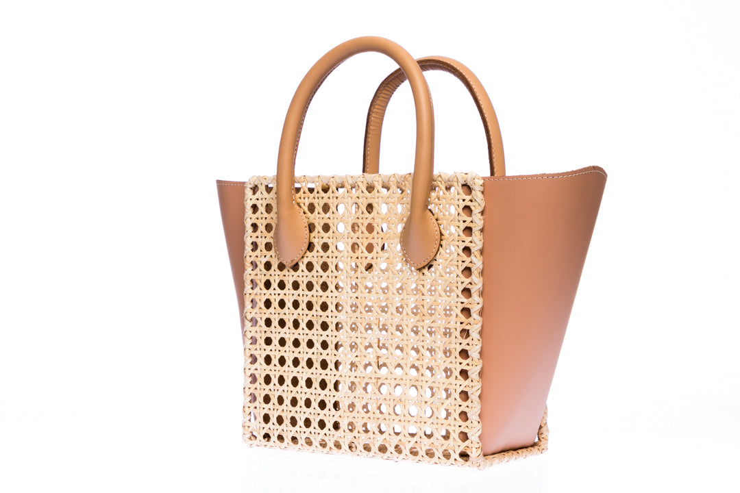 Honeycomb Solihiya rattan bag, handwoven with natural rattan and featuring leather handles, a linen lining, and a timeless design perfect for everyday use.