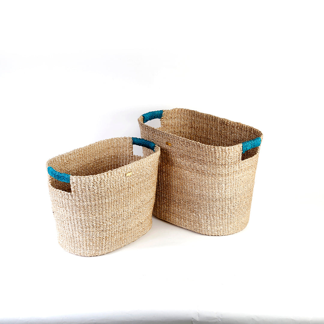 Ivy Oval Storage Baskets Set of 2, handcrafted from natural plant fibers, shown in small and large sizes for stylish and eco-friendly home organization.