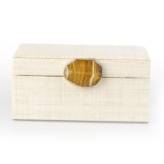 Karuna Raffia Jewelry Box crafted from handwoven natural plant fiber raffia with an agate stone accent capped in hand-tooled brass, perfect for stylish and eco-friendly jewelry storage.