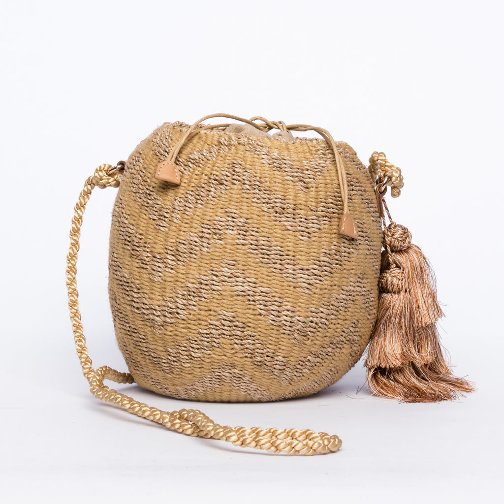 Larone Kate Circle Shoulder Bag featuring intricate zigzag embroidery on natural plant fiber, polka dot cotton lining, and cow leather handles for a comfortable fit. Perfect for stylish city outings.