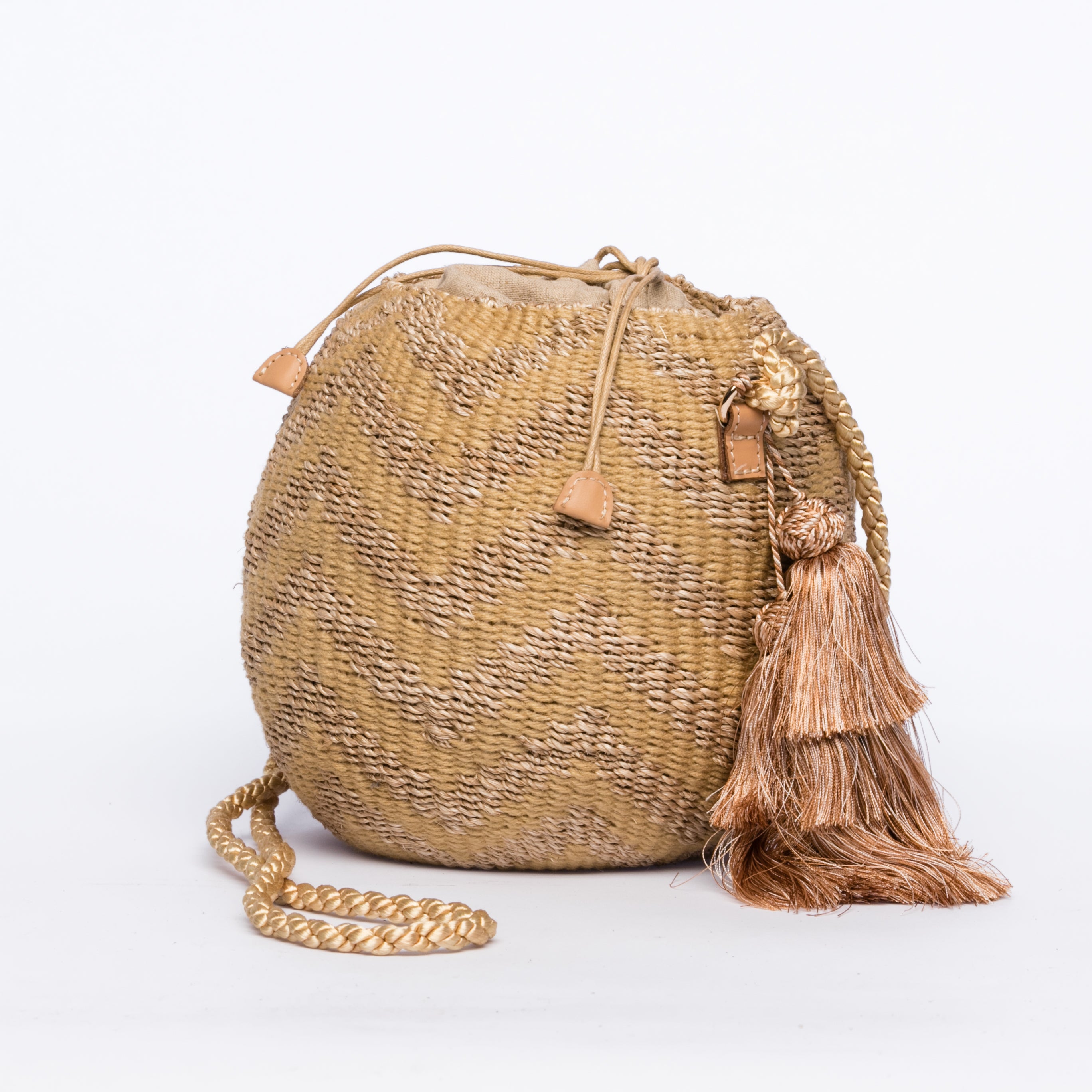 Larone Kate Circle Shoulder Bag featuring intricate zigzag embroidery on natural plant fiber, polka dot cotton lining, and cow leather handles for a comfortable fit. Perfect for stylish city outings.