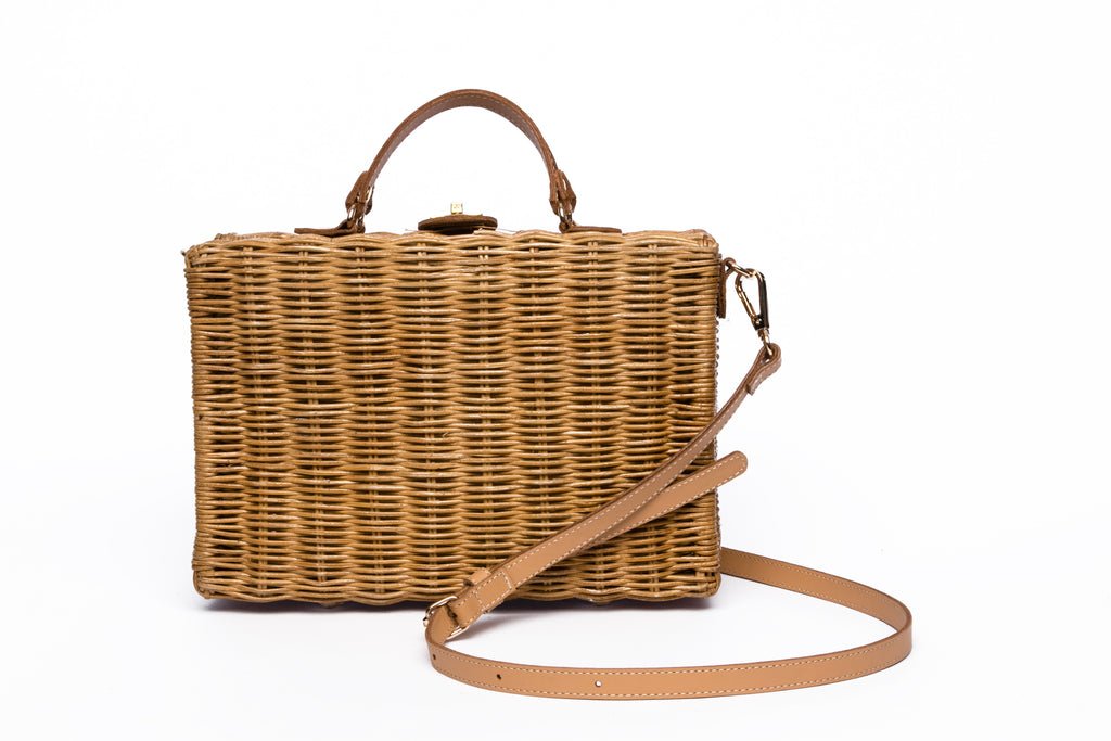 Mio Wicker Rattan Lunchbox with leather crossbody strap, handwoven from sustainable rattan, featuring clean lines and a minimalist design.