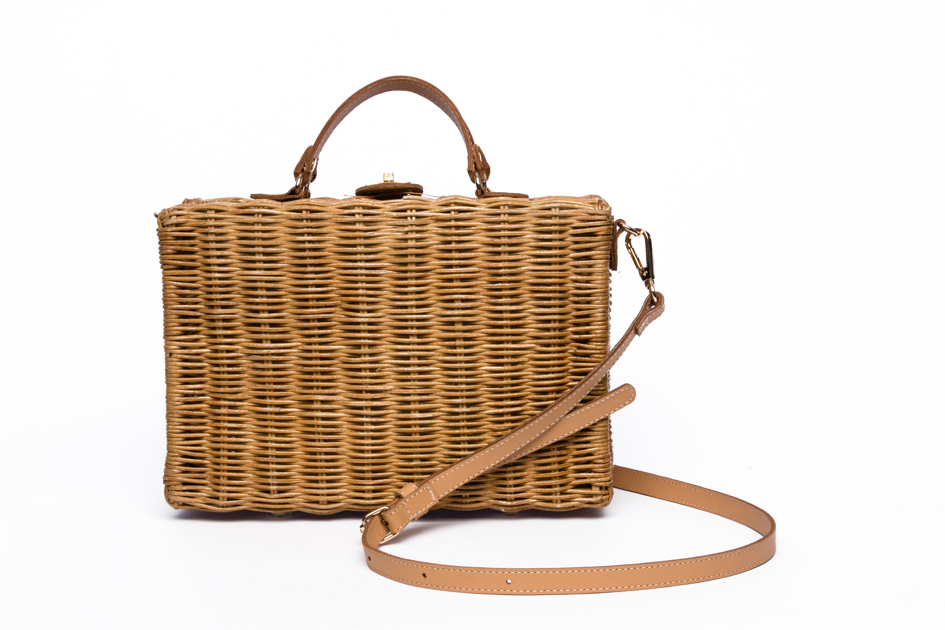 Mio Wicker Rattan Lunchbox with leather crossbody strap, handwoven from sustainable rattan, featuring clean lines and a minimalist design.