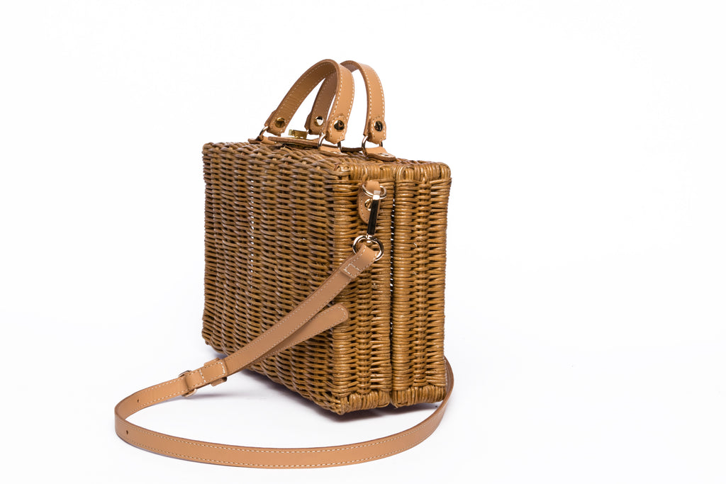 Mio Wicker Rattan Lunchbox with leather crossbody strap, handwoven from sustainable rattan, featuring clean lines and a minimalist design.