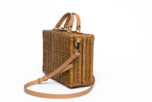Load image into Gallery viewer, Mio Wicker Rattan Lunchbox with leather crossbody strap, handwoven from sustainable rattan, featuring clean lines and a minimalist design.
