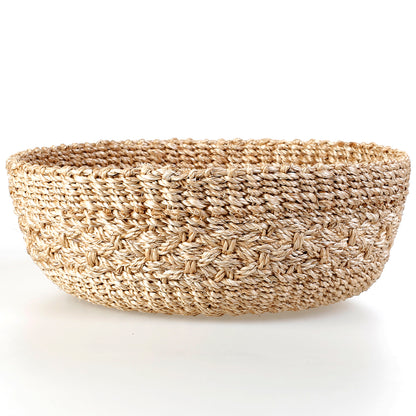 Handwoven natural plant fiber Myra Catch All tray for organizing jewelry, keys, and other essentials.