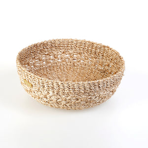 Handwoven natural plant fiber Myra Catch All tray for organizing jewelry, keys, and other essentials.