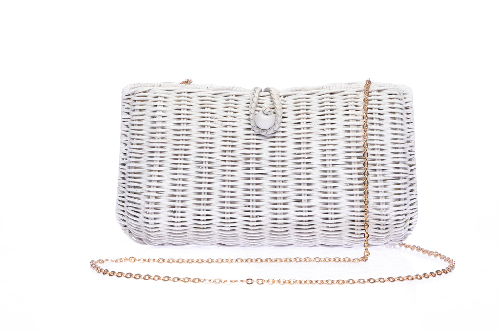 Myra Wicker Clutch White, handcrafted from rattan with a brass chain strap and a soft linen-cotton lining, perfect for day and evening wear.