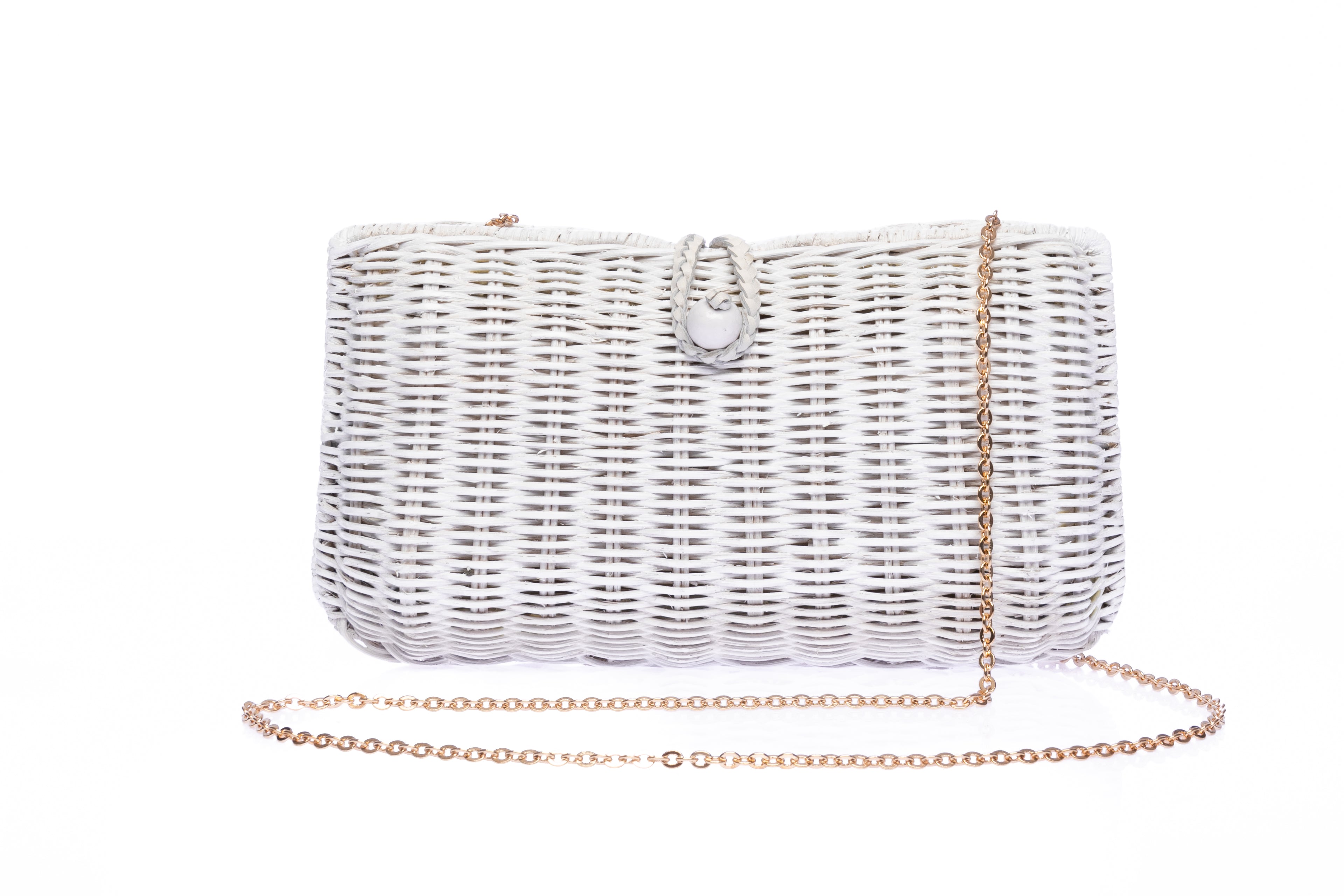 Myra Wicker Clutch White, handcrafted from rattan with a brass chain strap and a soft linen-cotton lining, perfect for day and evening wear.