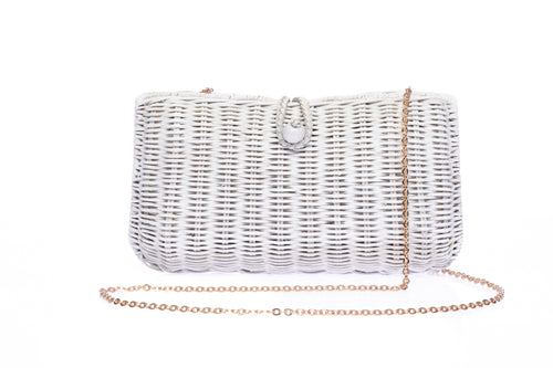 Myra Wicker Clutch White, handcrafted from rattan with a brass chain strap and a soft linen-cotton lining, perfect for day and evening wear.