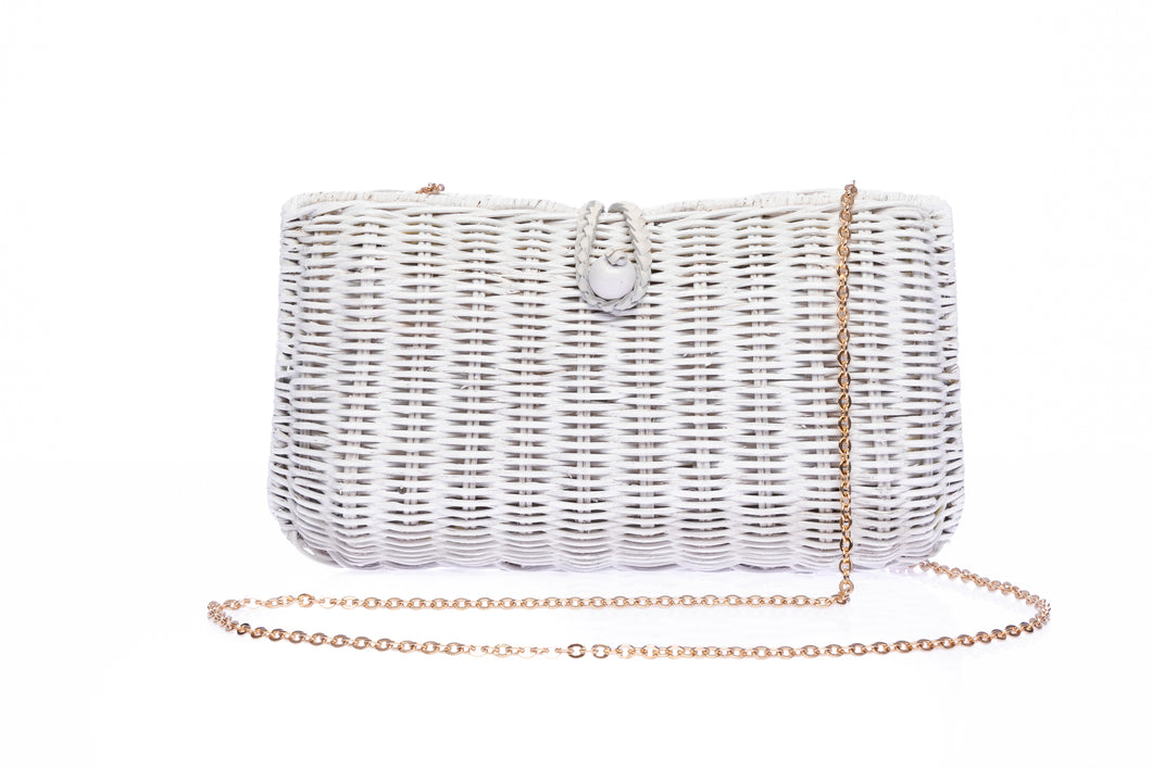 Myra Wicker Clutch White, handcrafted from rattan with a brass chain strap and a soft linen-cotton lining, perfect for day and evening wear.