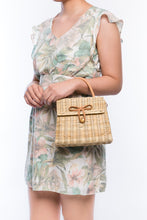 Load image into Gallery viewer, Adie wicker natural shoulder bag, handwoven from sustainable rattan with a cotton strap and brass hardware, eco-friendly and stylish.
