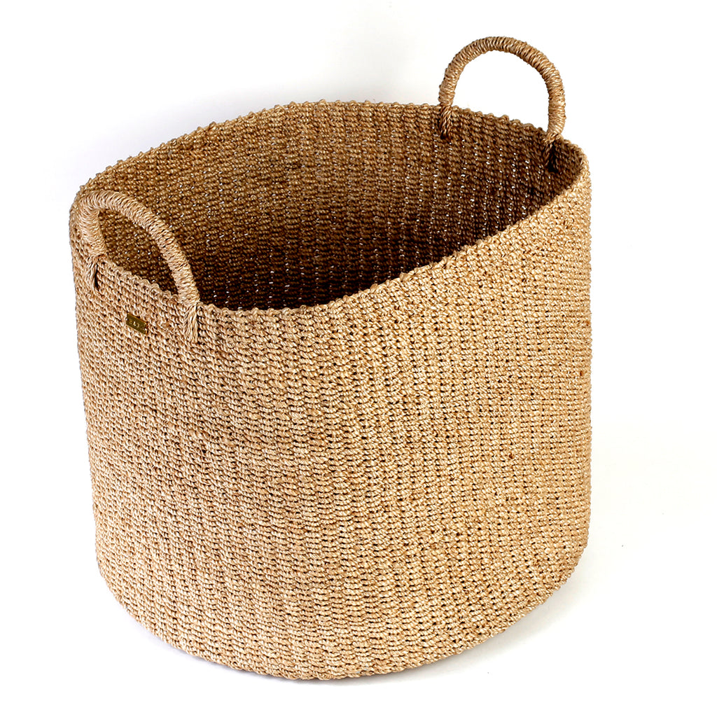 Camille Round Storage Basket made from 100% natural plant fiber, ideal for laundry, toy storage, and organizing essentials. Eco-friendly and stylish design.