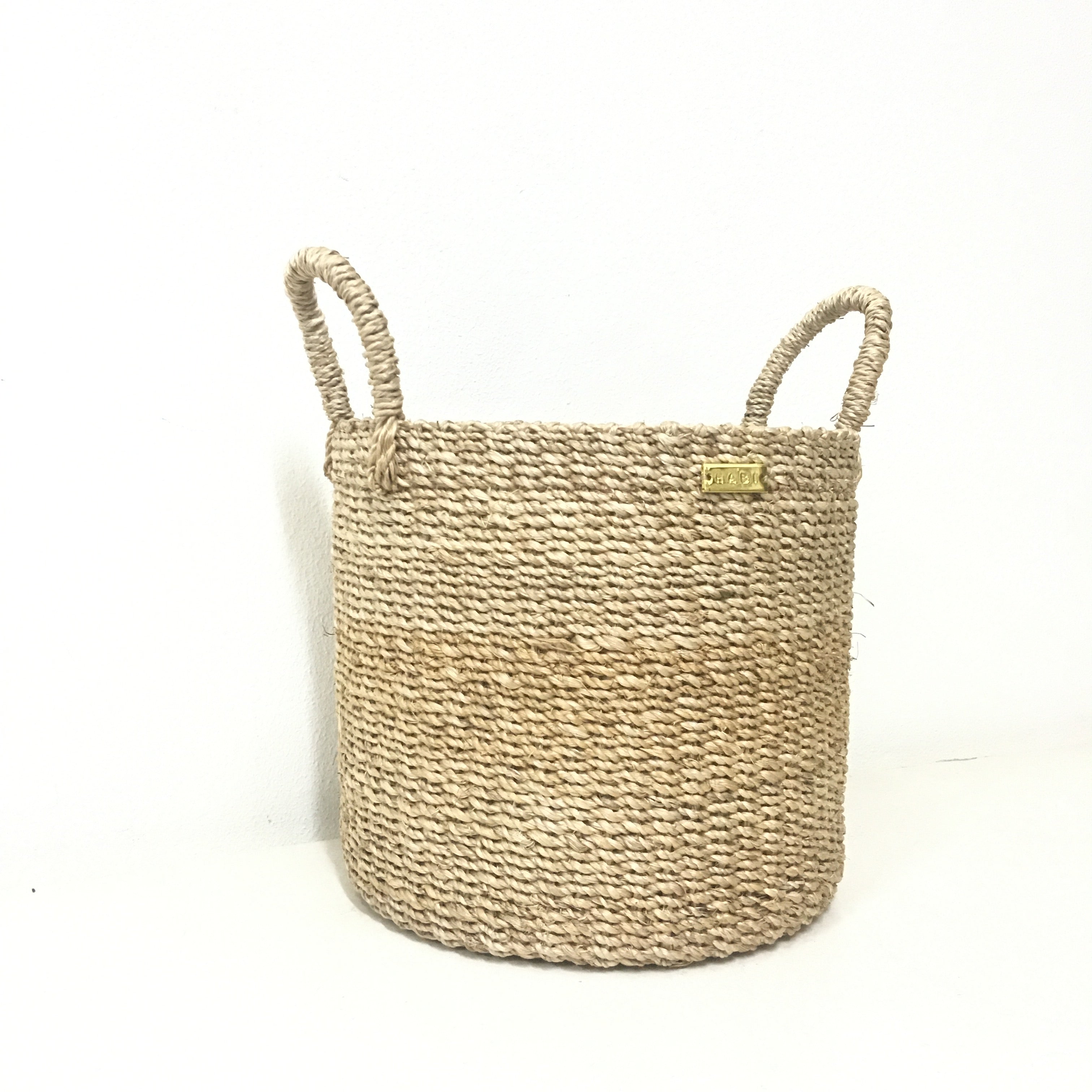 Dinah Catch-All Basket made from 100% natural plant fiber, ideal for organizing keys, spices, bath essentials, or as a planter cover.