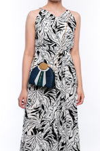 Load image into Gallery viewer, Gatsby Navy half-moon clutch made from handwoven natural plant fibers with a cracked sea shell bar and a brass chain strap, offering elegance and sophistication for evening events.
