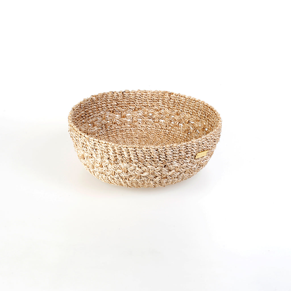 Handwoven natural plant fiber Myra Catch All tray for organizing jewelry, keys, and other essentials.