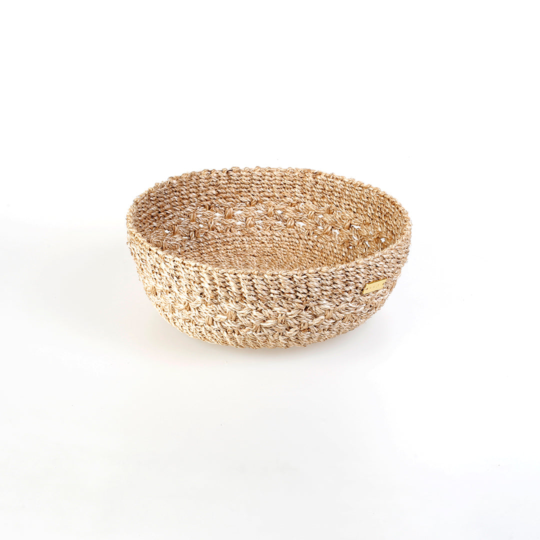 Handwoven natural plant fiber Myra Catch All tray for organizing jewelry, keys, and other essentials.