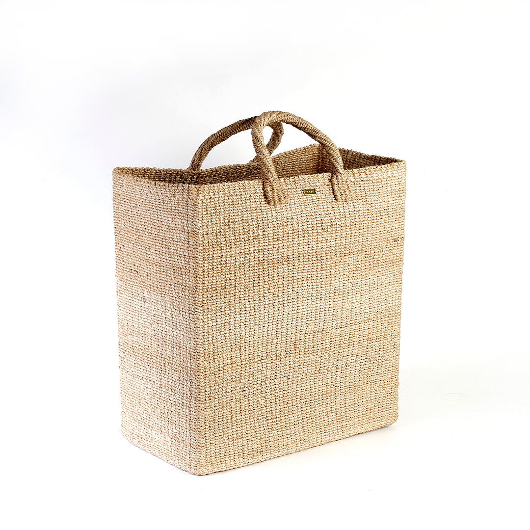 Serene Rectangle Storage basket, handcrafted from natural plant fibers, dimensions 17" Length x 10" Width x 19" Height. Ideal for storing laundry, sports equipment, and seasonal items.