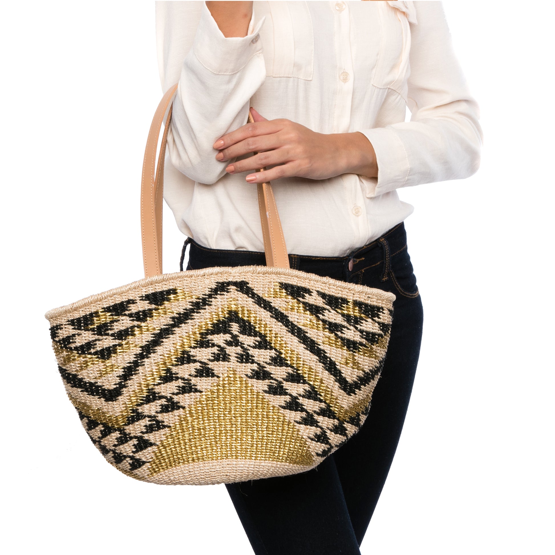 Queen of the Hills Millie Tote, handwoven from natural plant fibers and polyester cord, featuring cow leather handles, a polka dot cotton lining, and functional zippered and open pockets.