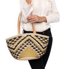 Load image into Gallery viewer, Queen of the Hills Millie Tote, handwoven from natural plant fibers and polyester cord, featuring cow leather handles, a polka dot cotton lining, and functional zippered and open pockets.
