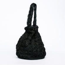 Load image into Gallery viewer, Rie Pouchette Black wristlet and shoulder bag, handcrafted from sustainable abaca plant fiber with delicate crochet detailing and adjustable leather strap for versatile use.
