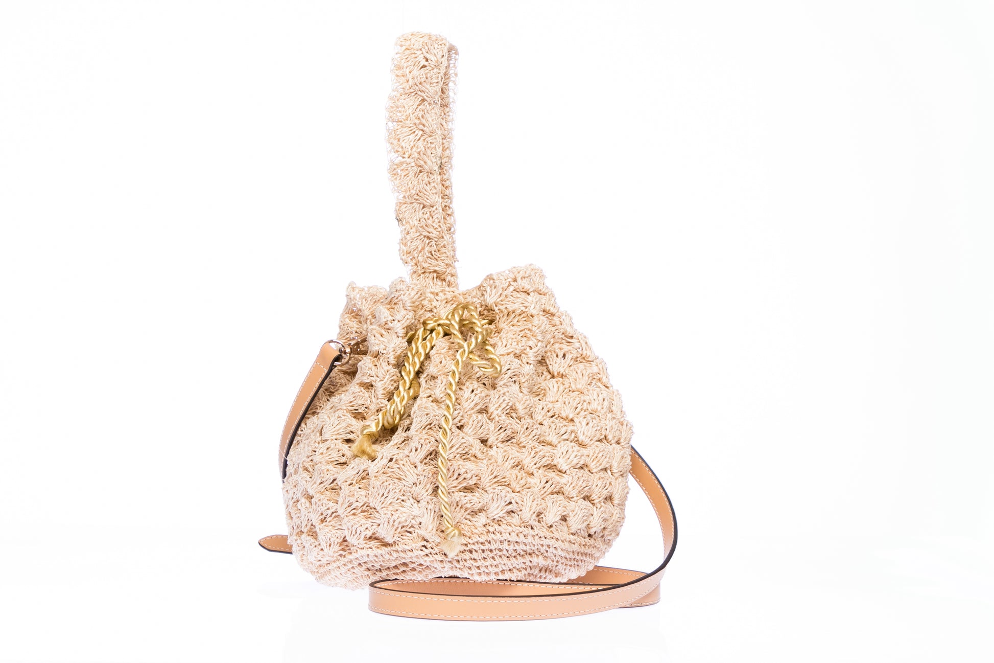 Rie Pouchette wristlet and shoulder bag, handcrafted from sustainable abaca plant fiber with delicate crochet detailing and adjustable leather strap for versatile use.