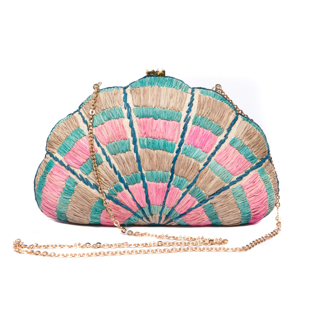 Seashell Karuna Rainbow Clutch, hand-loomed raffia body with hand embroidery, adorned with freshwater pearls wrapped in brass, and a versatile brass drop-in chain strap.