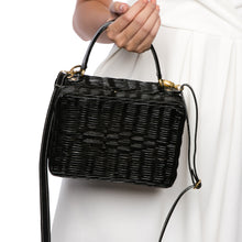 Load image into Gallery viewer, Serene Waters Wicker Bag made from handwoven rattan with an adjustable leather strap and cotton lining. Perfect for holding essentials with a chic and sustainable design.
