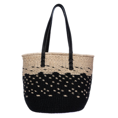 Starry Night Tote made from natural plant fiber with soft cow leather handles and a spacious interior for everyday essentials. Perfect for casual or elegant outfits.