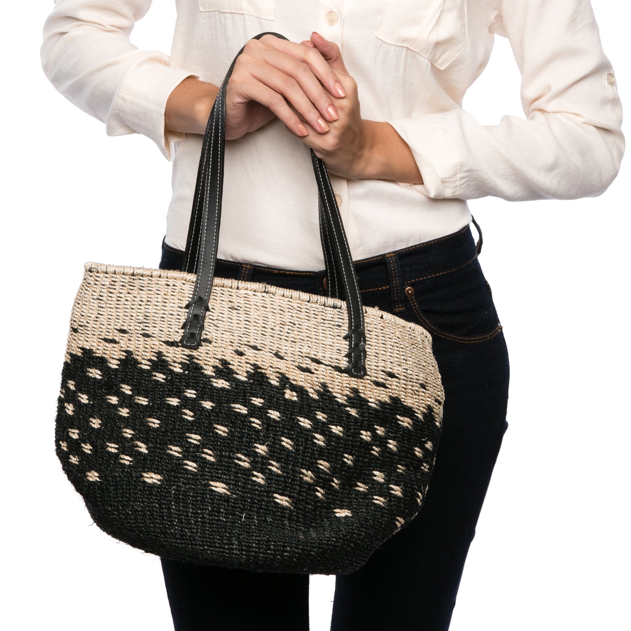 Starry Night Tote made from natural plant fiber with soft cow leather handles and a spacious interior for everyday essentials. Perfect for casual or elegant outfits.